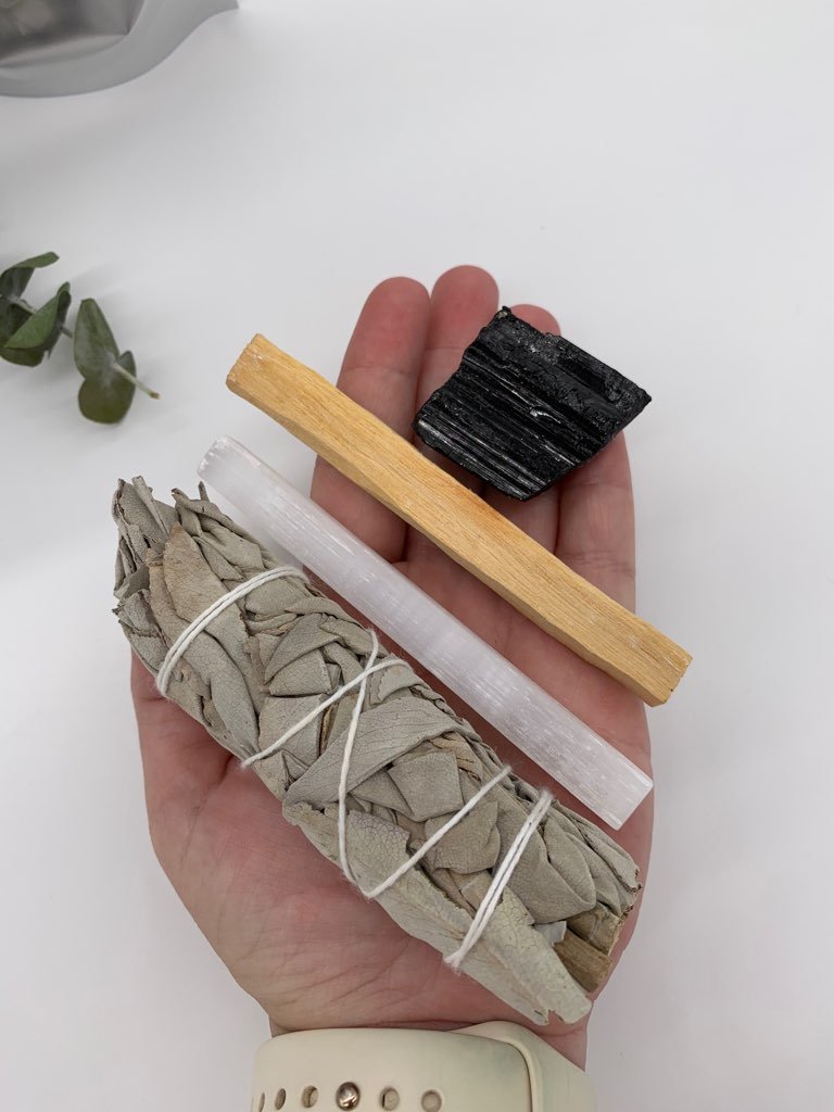 The kit includes: Sage stick, palo santo stick, selenite stick, and black tourmaline.